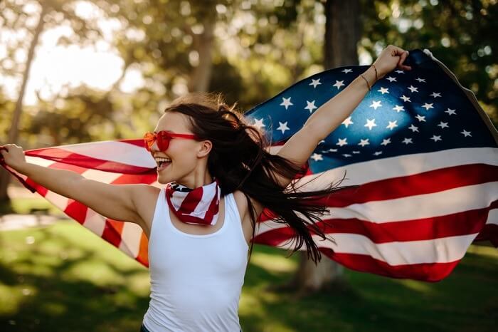 Smiling woman with USA flag