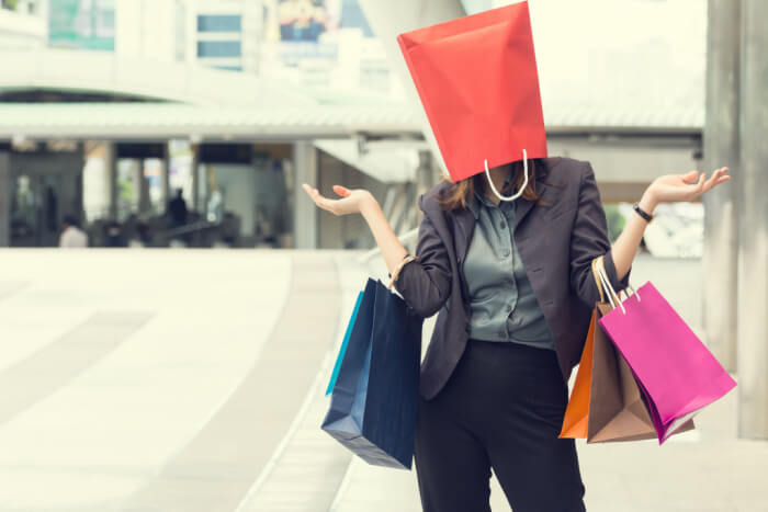 Woman shopping with bag on her head
