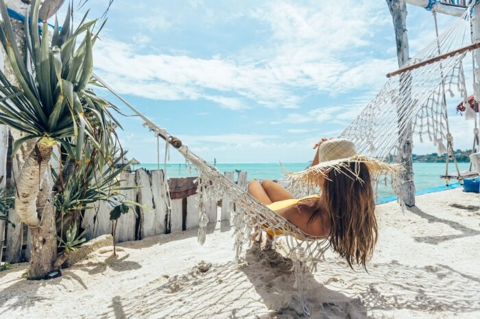 Woman on beach hammock
