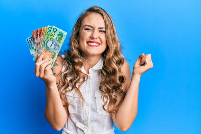 Woman holding australian money