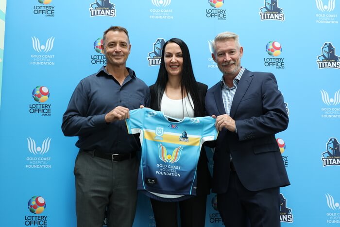The Lottery Office CEO Jaclyn Wood holding up Jersey